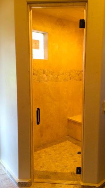 frameless glass shower door bronze hardware